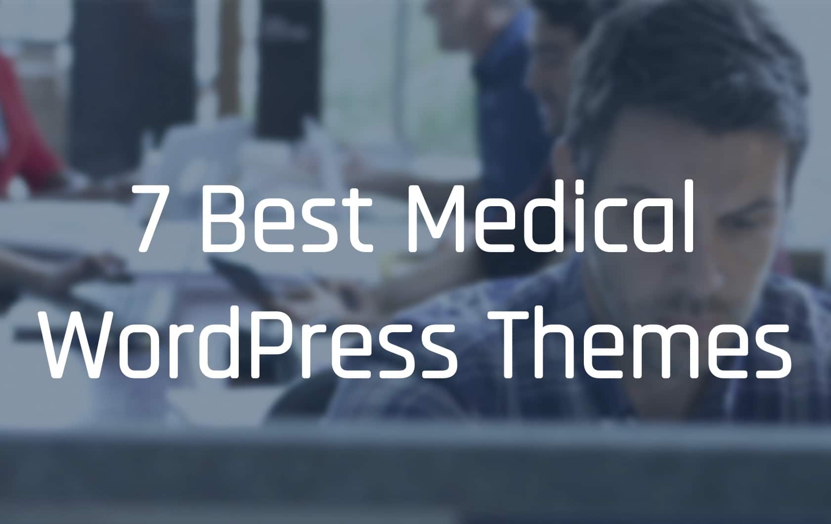 A person is smiling while looking at a screenshot of one of the seven best medical WordPress themes.