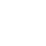 A person is driving a Land Rover off-road across a rugged terrain.